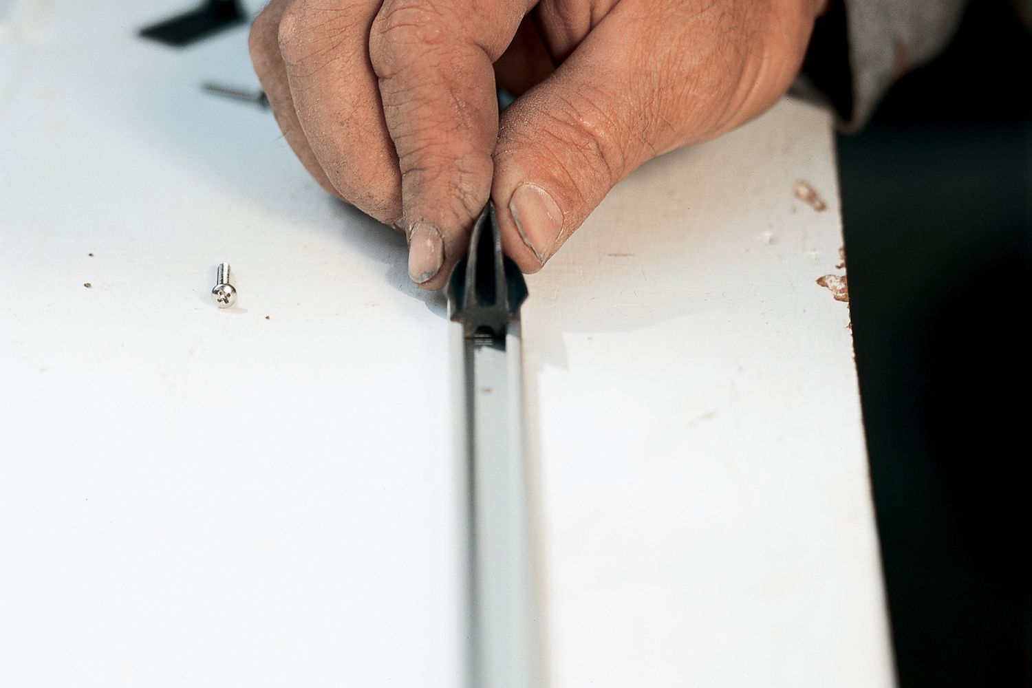 up close view of weatherstripping a door