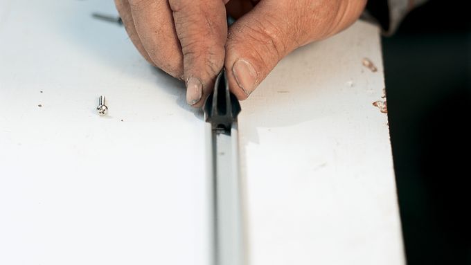 up close view of weatherstripping a door