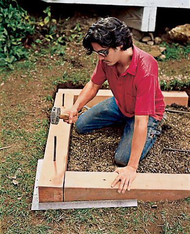 A man fastens the frame with rebar.