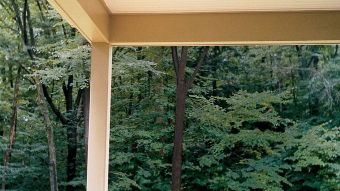 A porch with a beadboard ceiling.