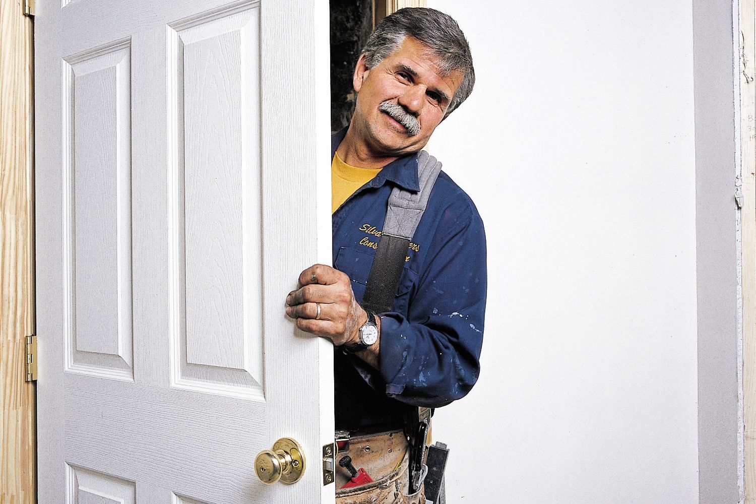 Photo of Tom Silva during the installation process for a prehung door