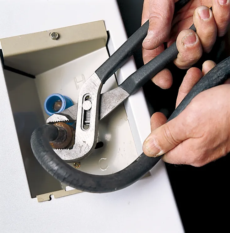 washing machine hose being inspected