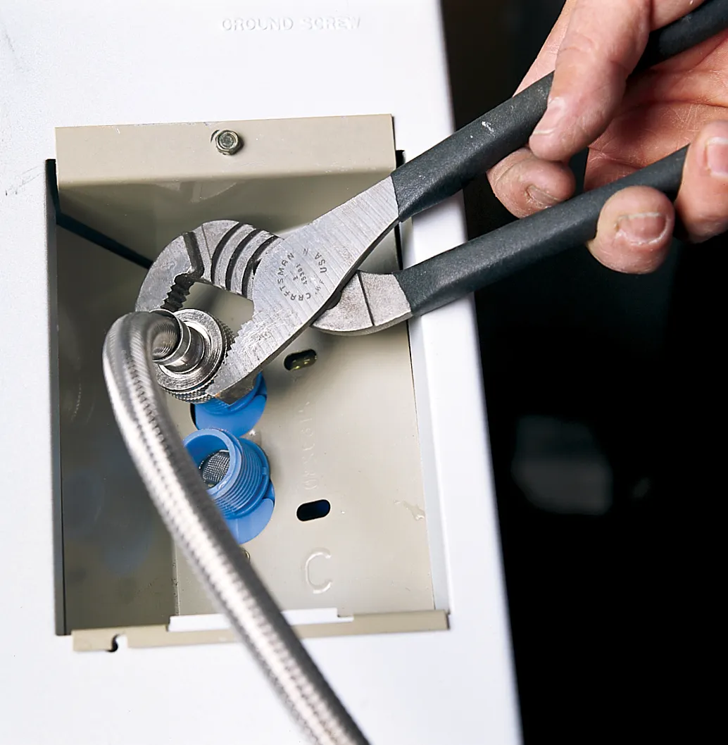 Person checking the drum or pump for foreign objects.