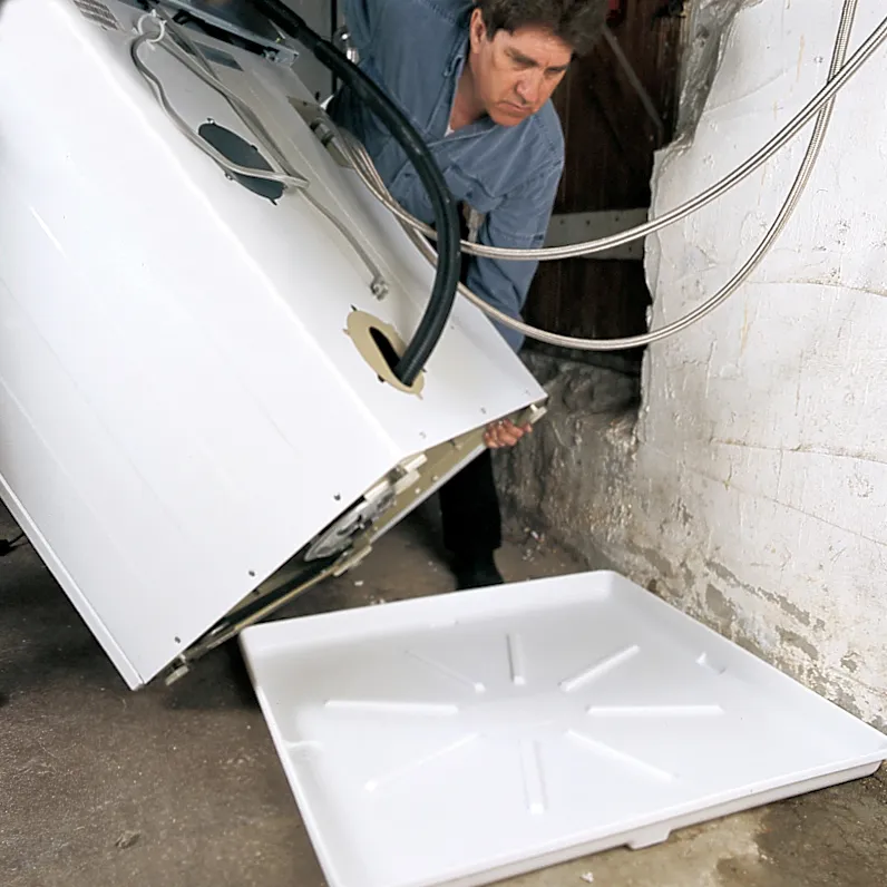 Person maintaining the hosing on their washer