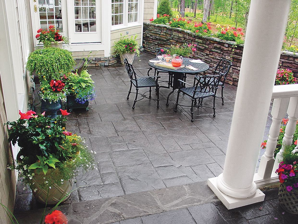 A concrete patio with a textured veneer.