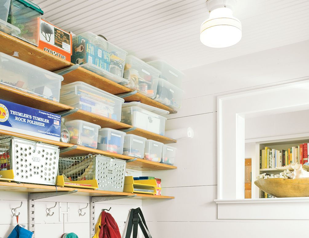 A wall-mounted unit with storage bins