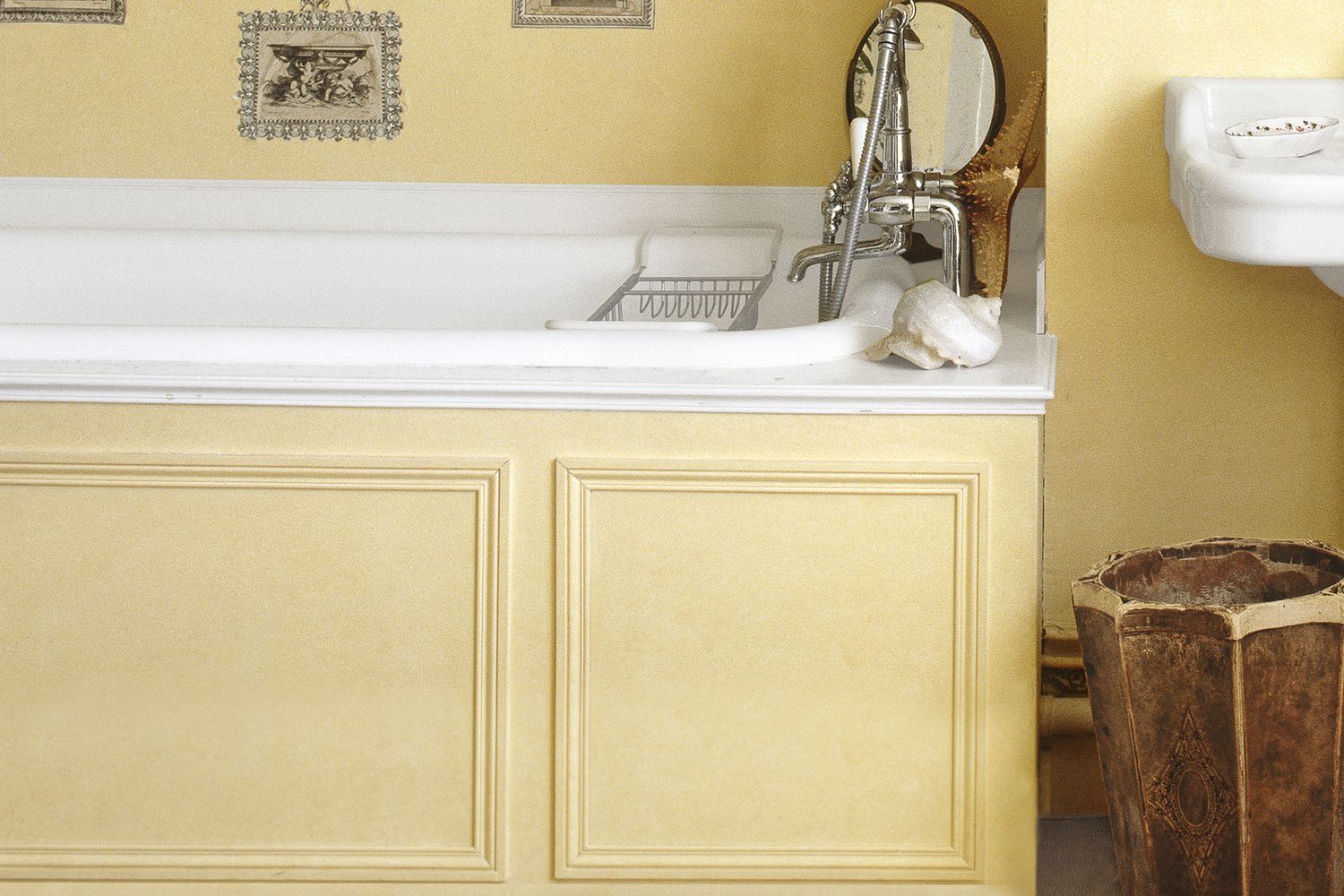 A bathroom painted yellow