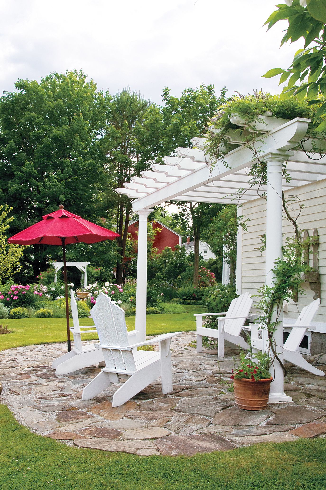 A rustic sandstone patio with a sitting area.