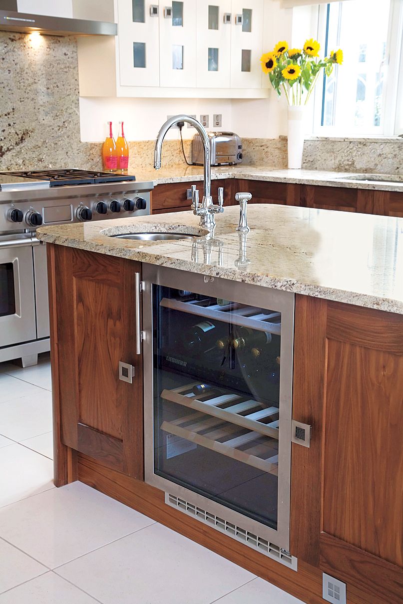 A kitchen island with built in refridgeration.