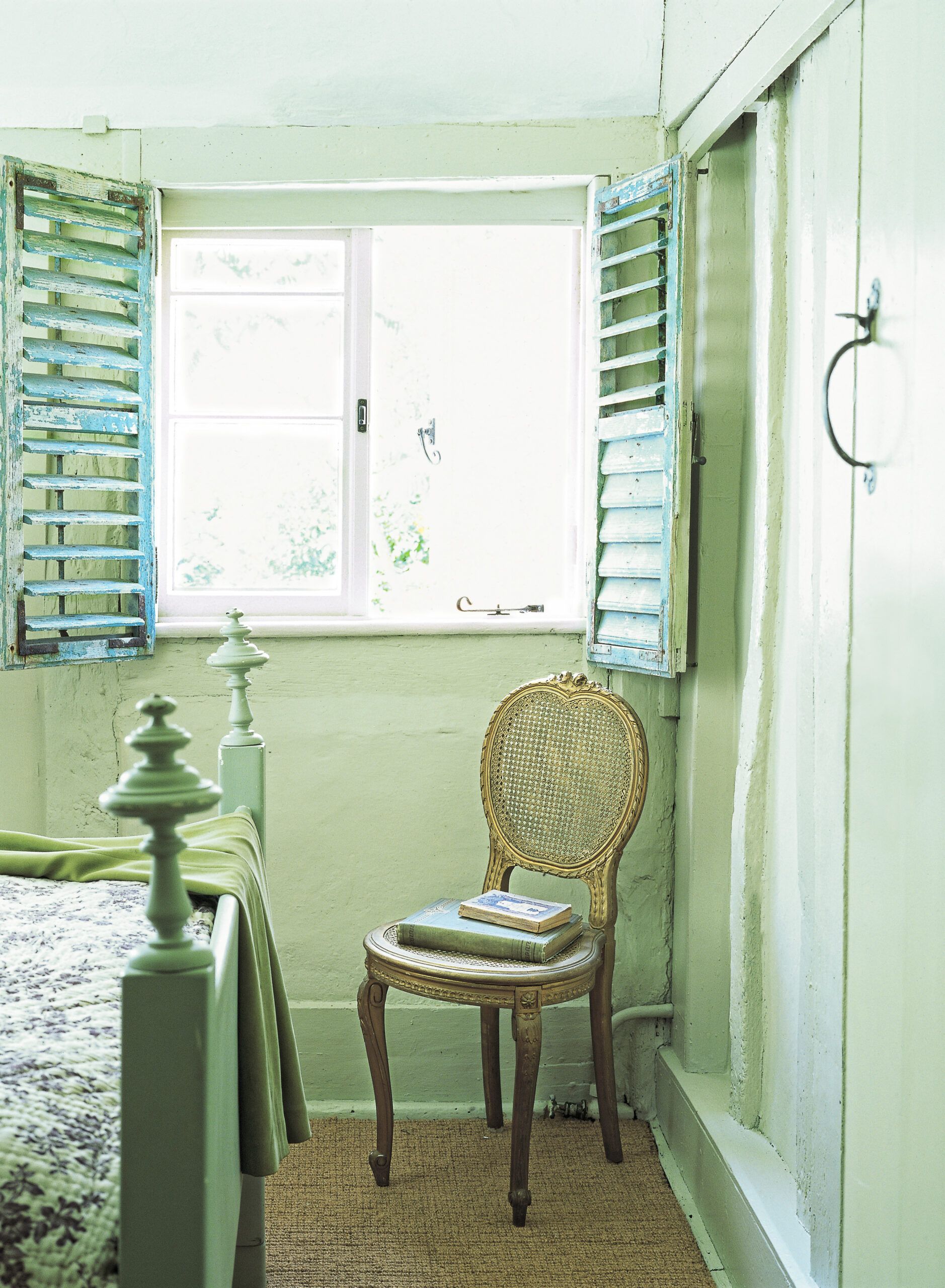 old, distressed interior shutters on a cottage-style interior of a home