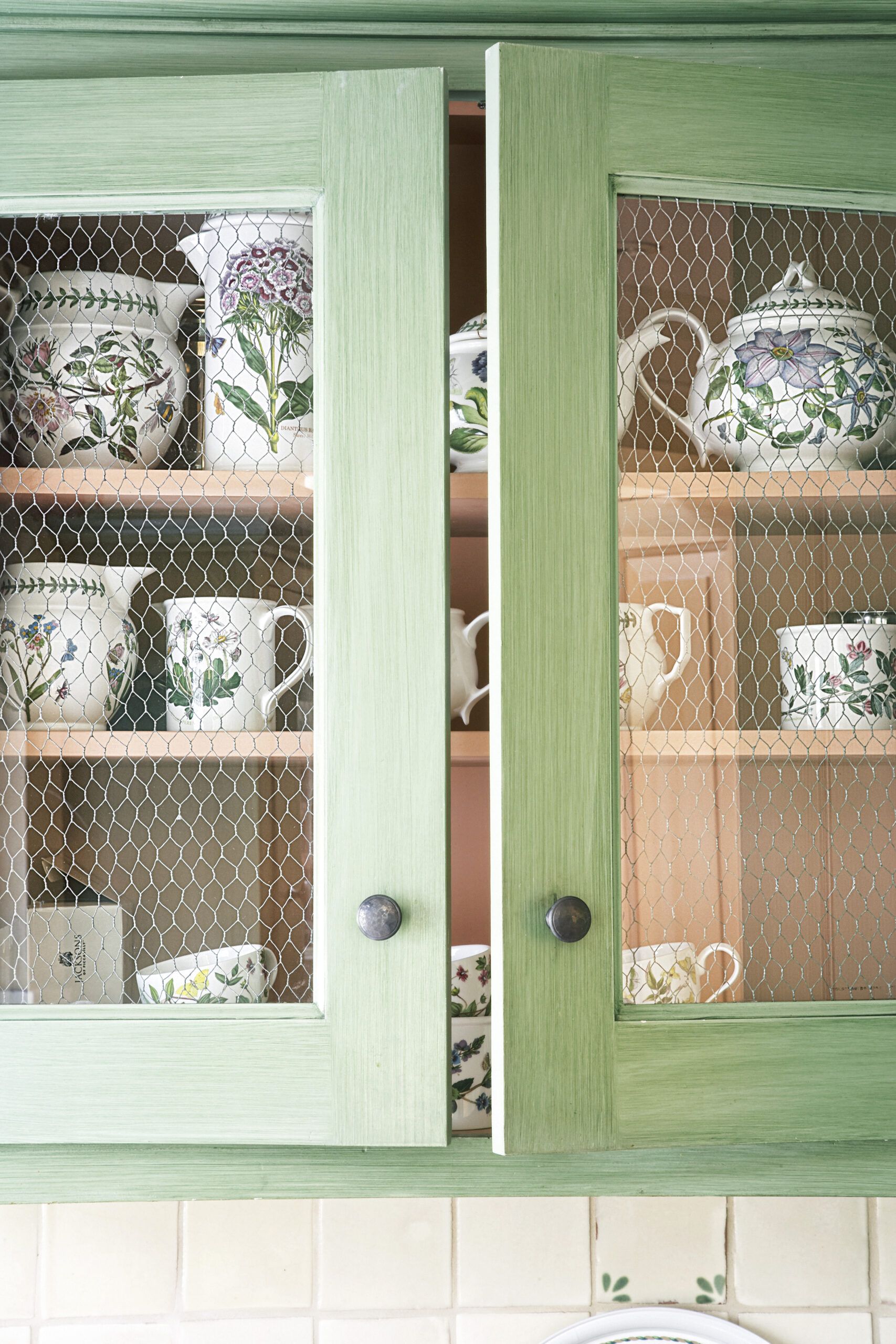 wire door panels on a cabinet to represent a cottage-style interior of a home