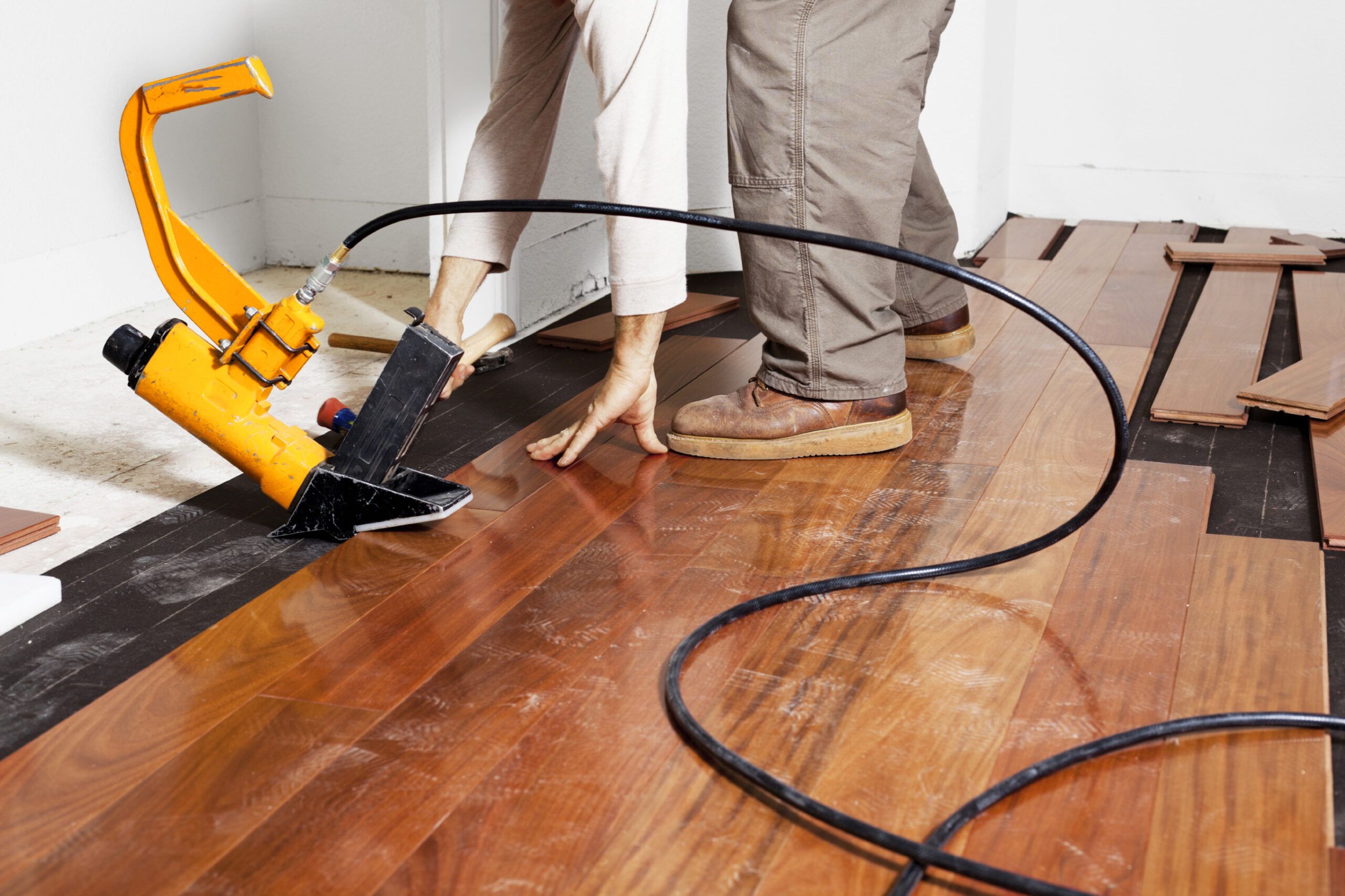 Prefinished wood floors being installed.