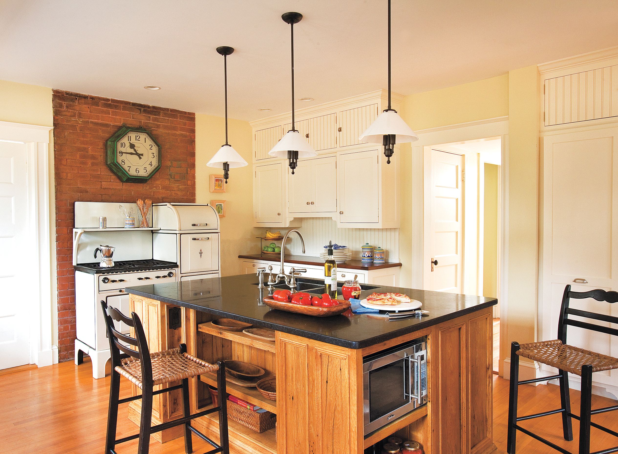 A kitchen island with several shelves and cabinets.