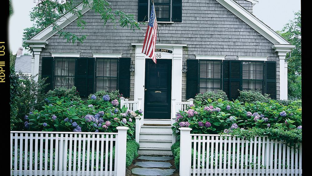 Flag pole installed in front of a home