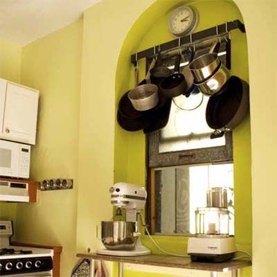 Storage in an arched window in the kitchen.