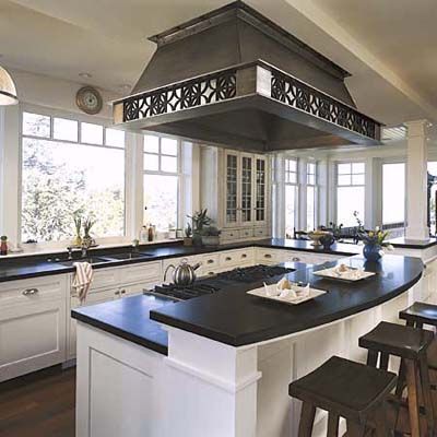 A multi-level counter on a kitchen island.