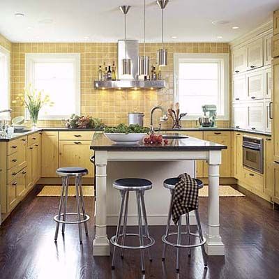 A kitchen island with stools around it.