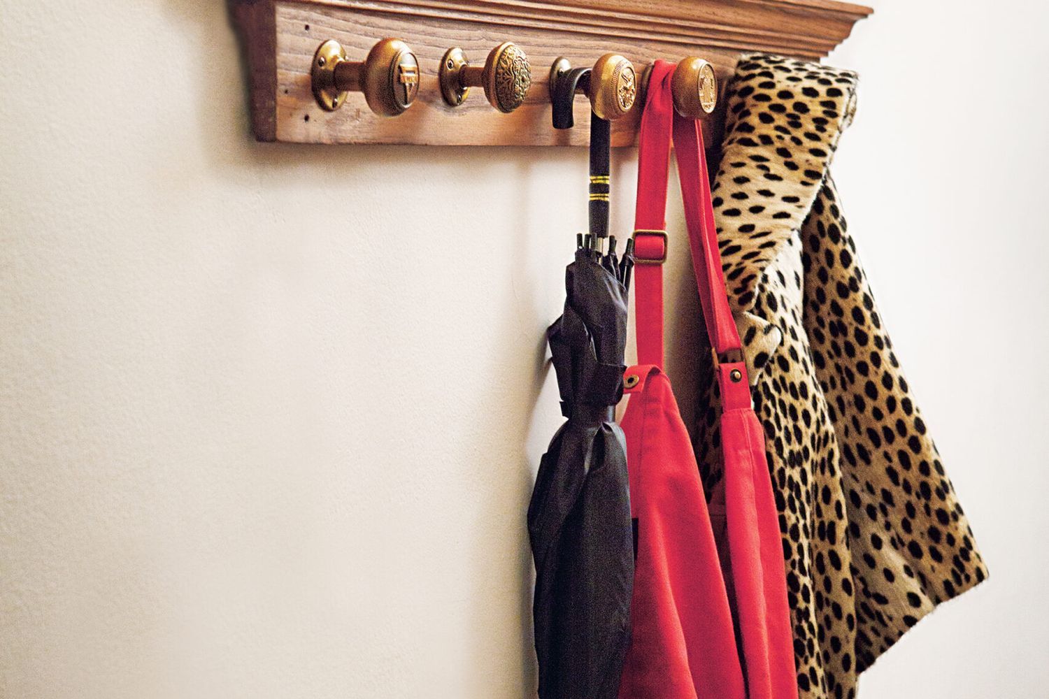 a finished doorknob coatrack project mounted on a wall