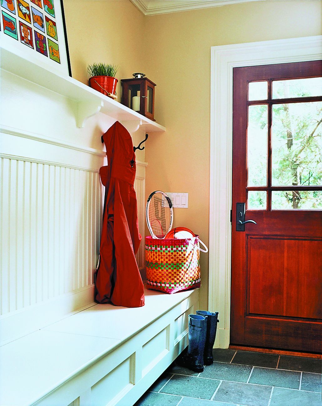 A mudroom bench with room for storage.