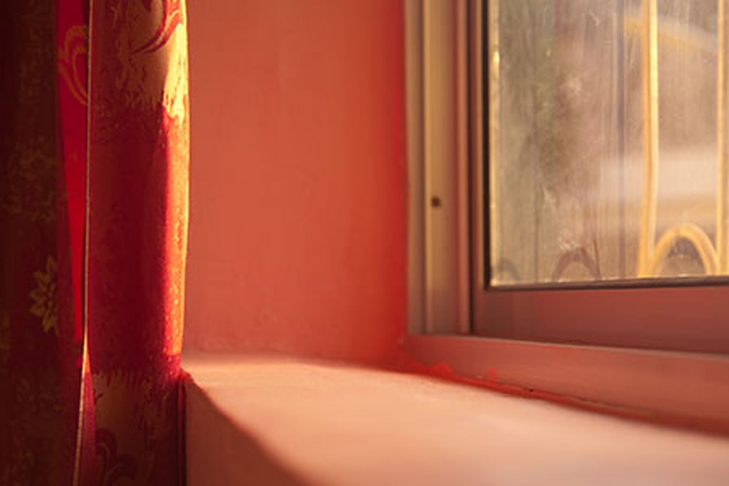 A close up image of a red window sill.