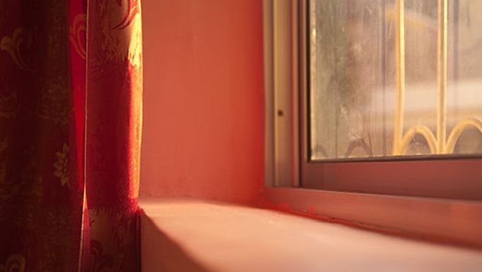 A close up image of a red window sill.