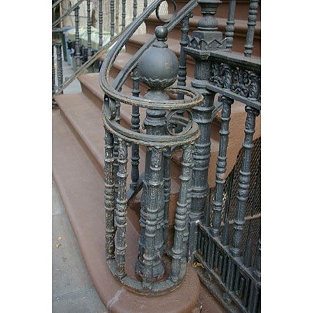 a cast iron circular newel post