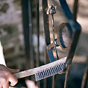 A brush being used to prime metalwork.