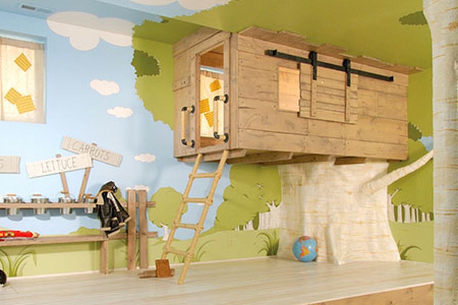 A kids playroom with a tree house