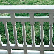 A porch rail with a classic design.