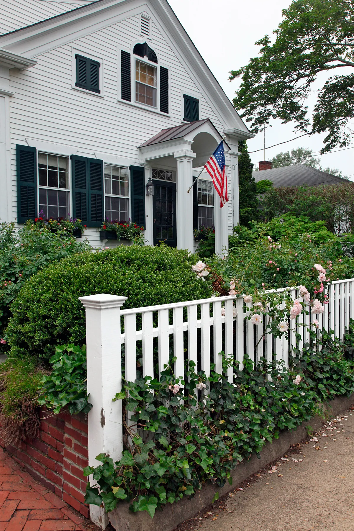 A picket fence with a capped end piece.