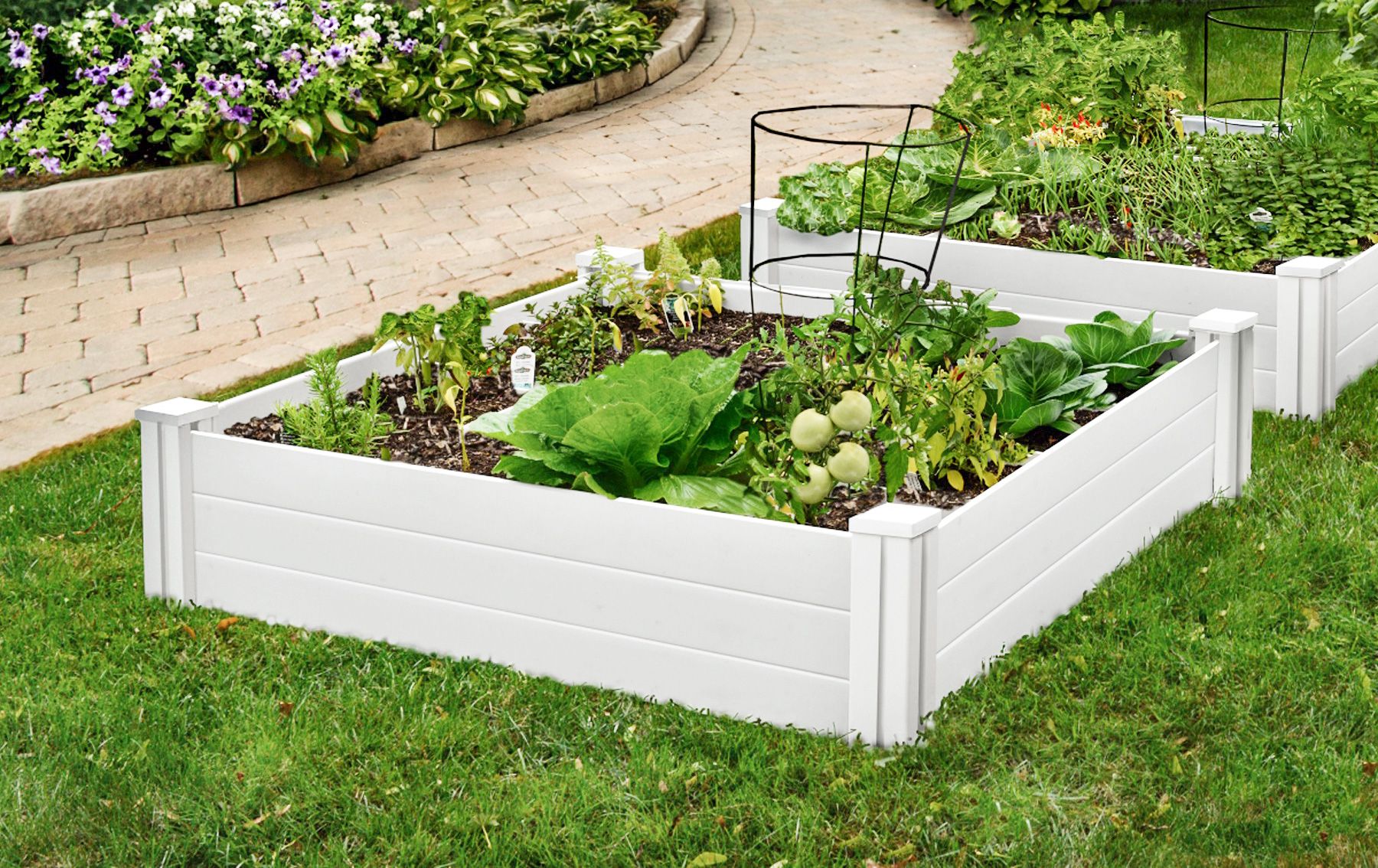 A PVC garden bed on a yard.