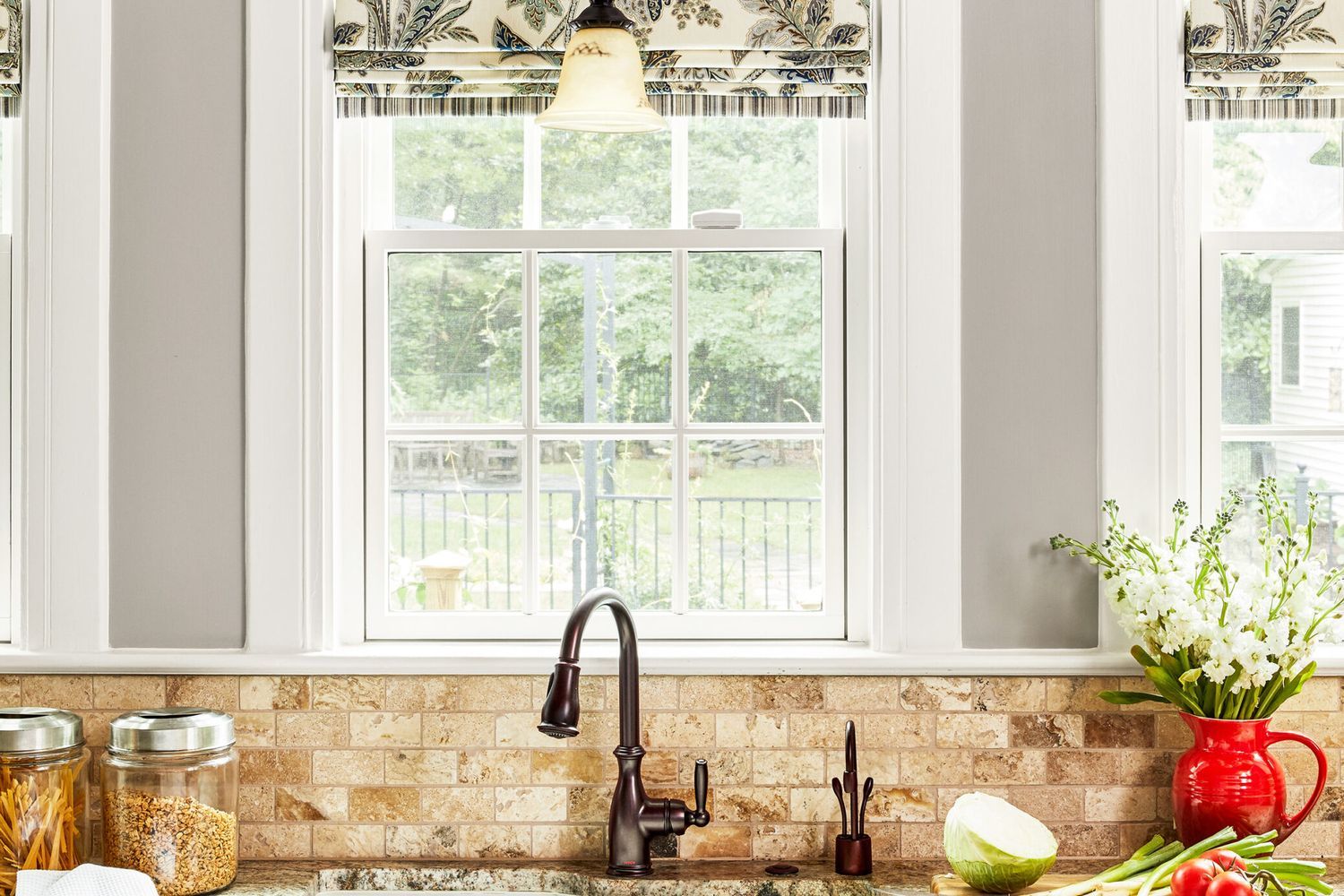 Image of a kitchen with a rustic stone backsplash
