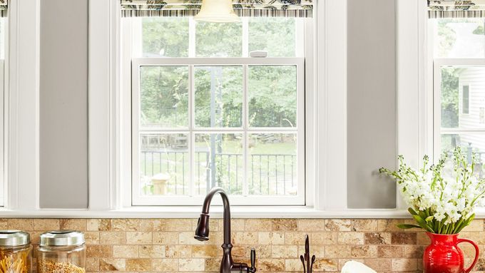 Image of a kitchen with a rustic stone backsplash