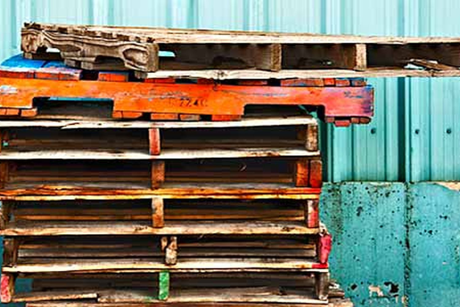 A pile of salvaged wood pallets.