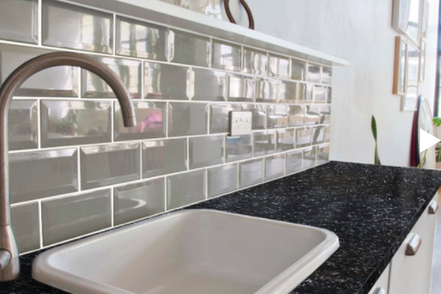 A bathroom with painted tile
