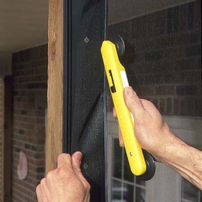 A man installs the screening.