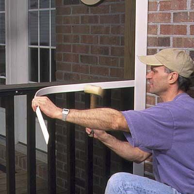 A man installs narrow cap trim.