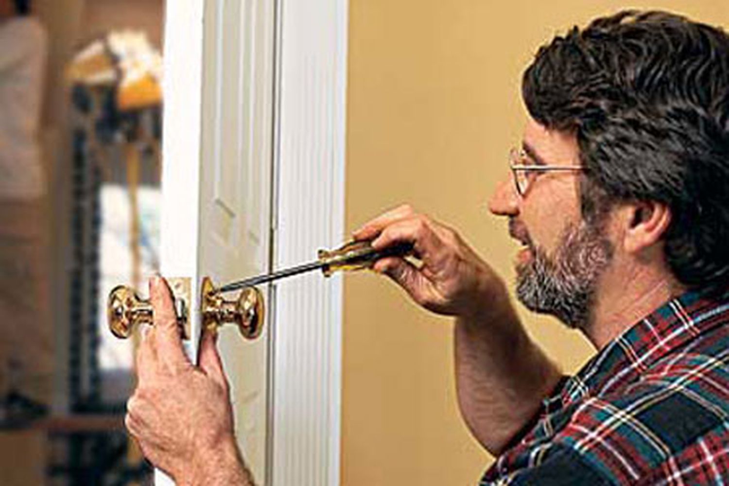 Norm Abram using a screwdriver.