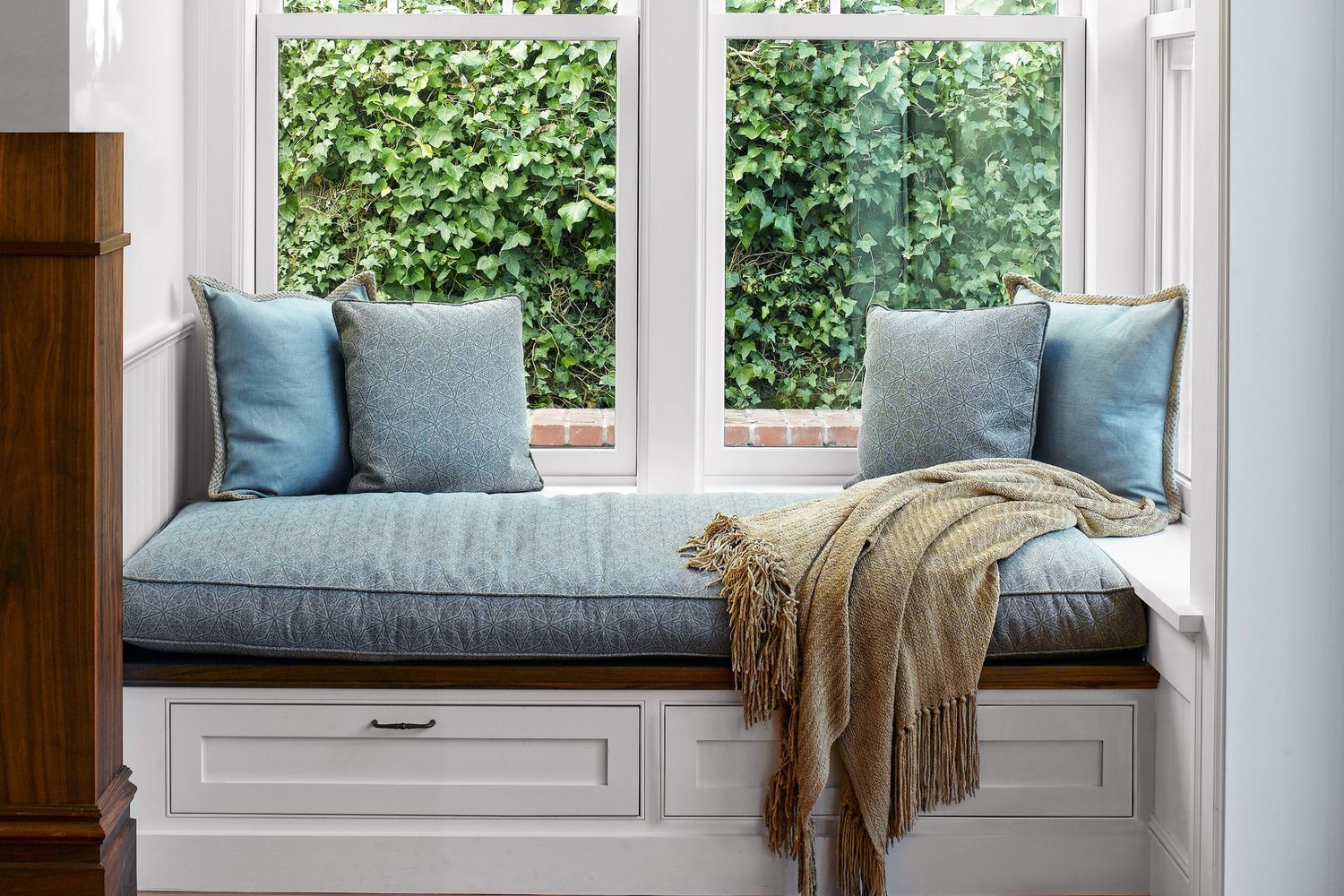 Window seat with blue cushioning
