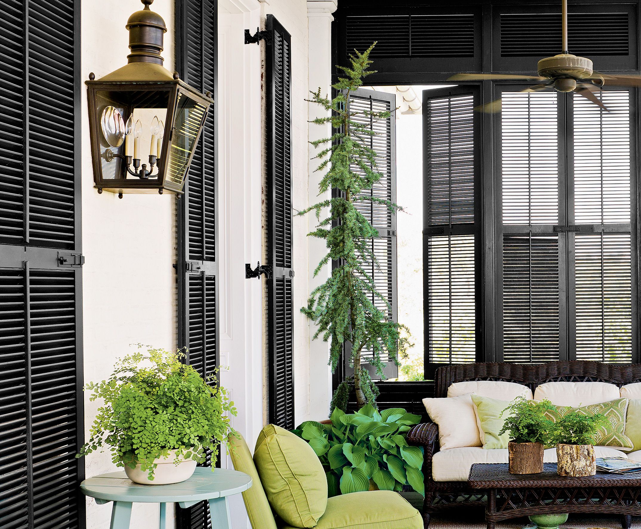 an up close view of black shutters surrounding an outdoor patio