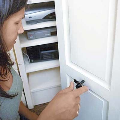 A handle is screwed onto the shutter cabinet door.