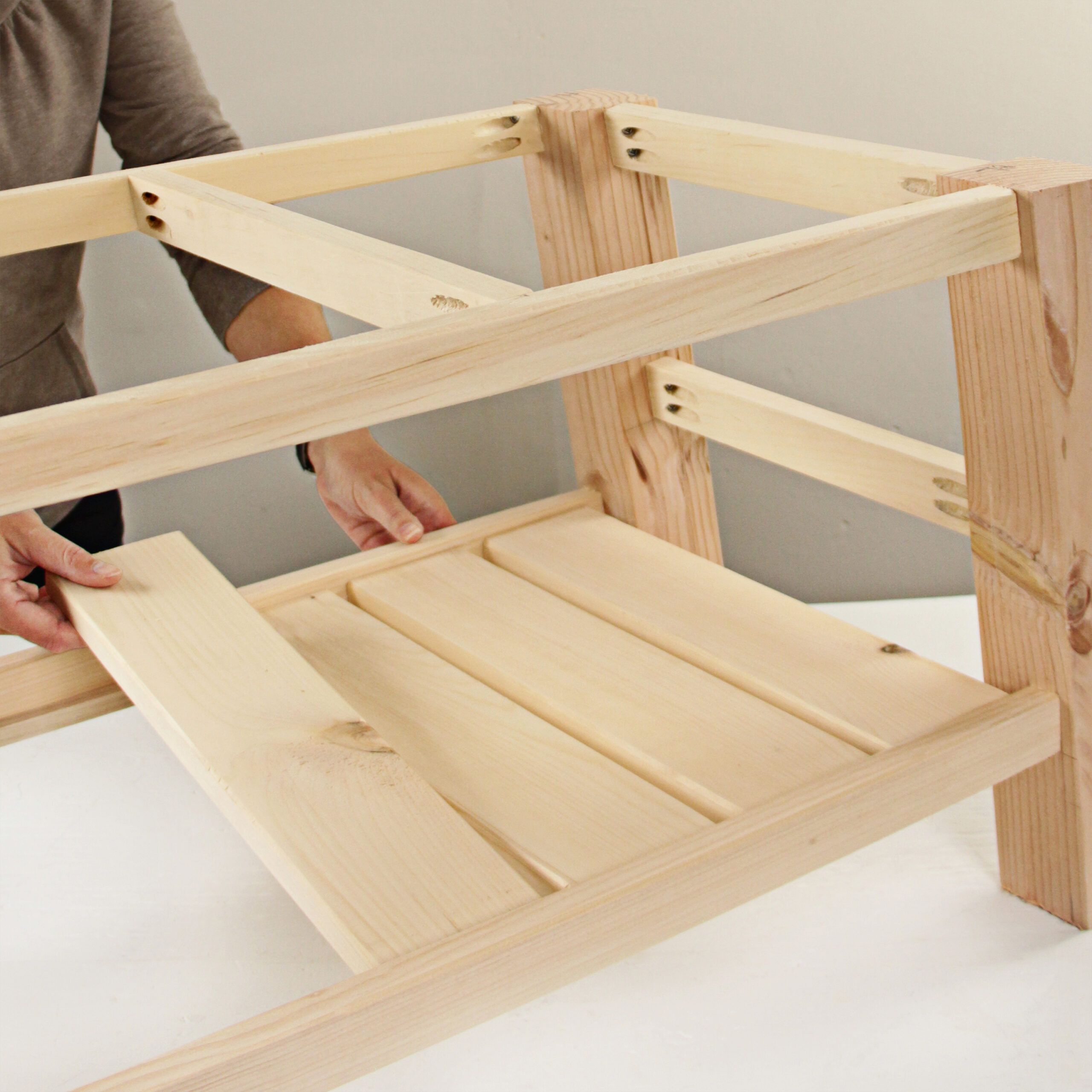 the correctly sized pieces of wood are added to complete the base of the coffee table