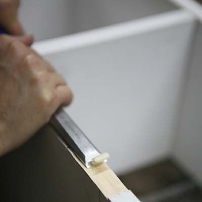 Image of a person creating mortises for their DIY stylish bar cart