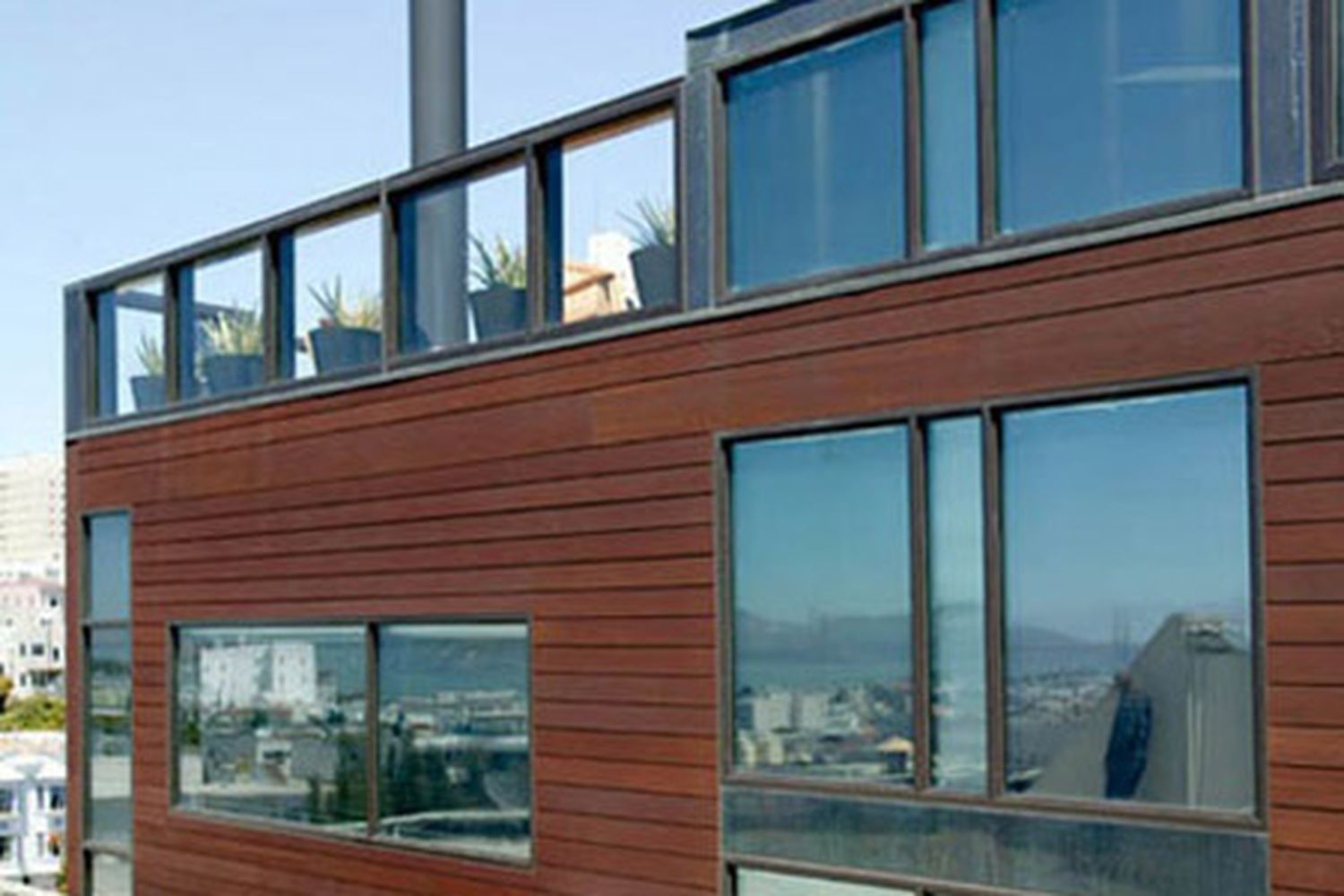 Building with a flat roof because of a rooftop patio.