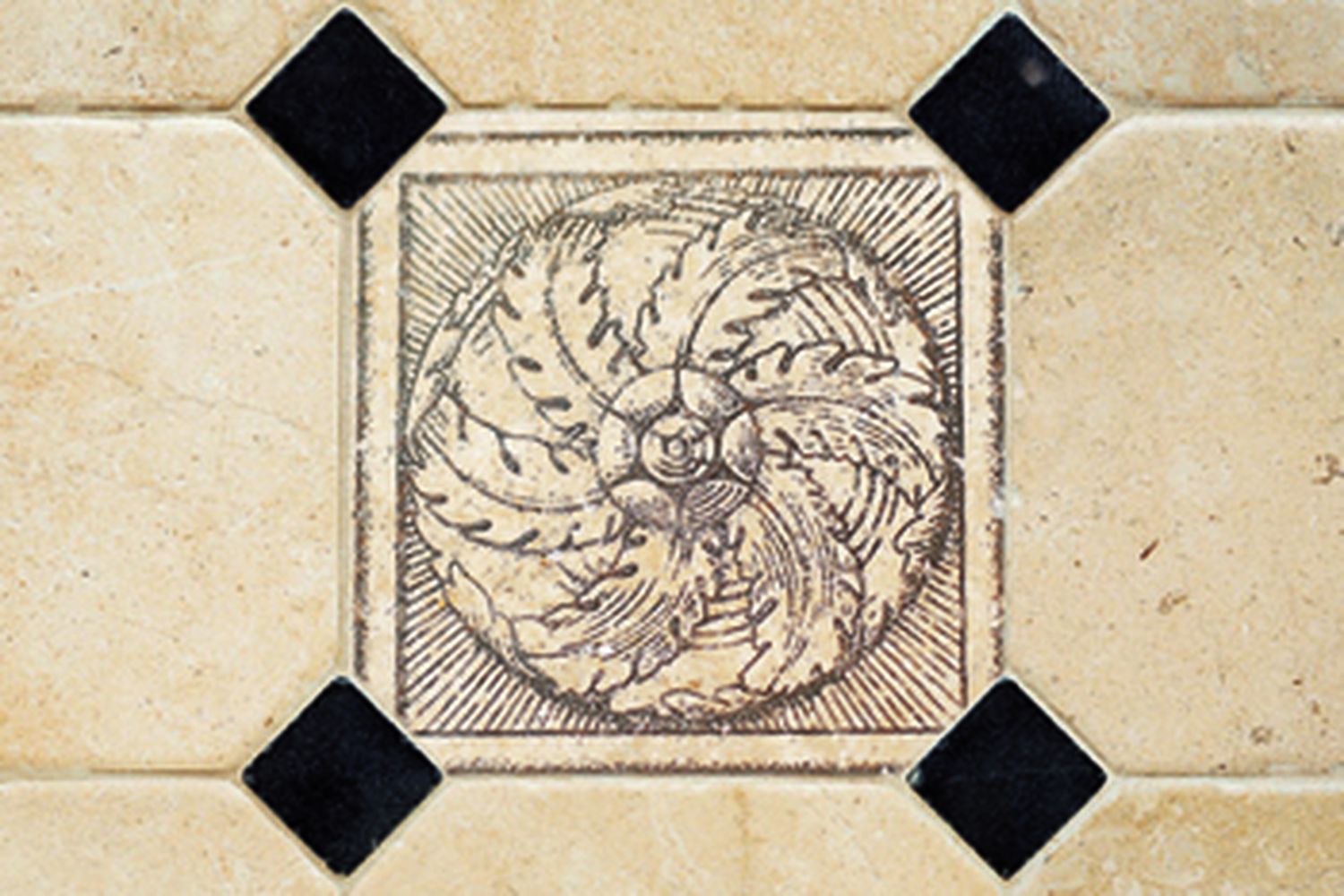 A patterned tile placed between two white tiles.