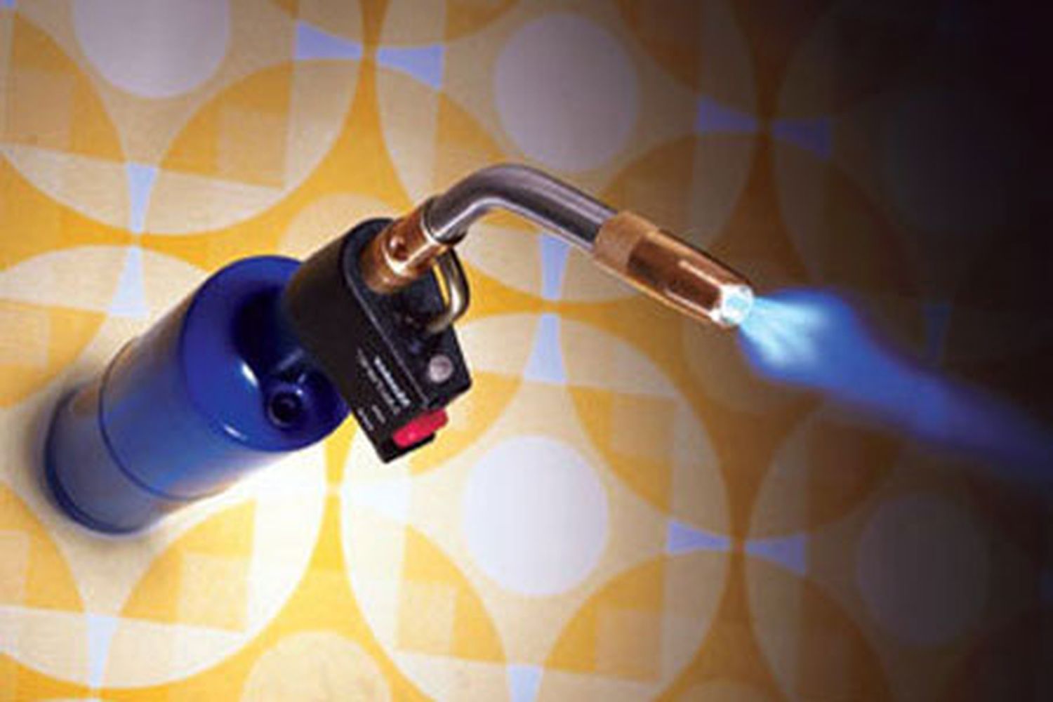 A torch sitting on a table releasing a blue flame.