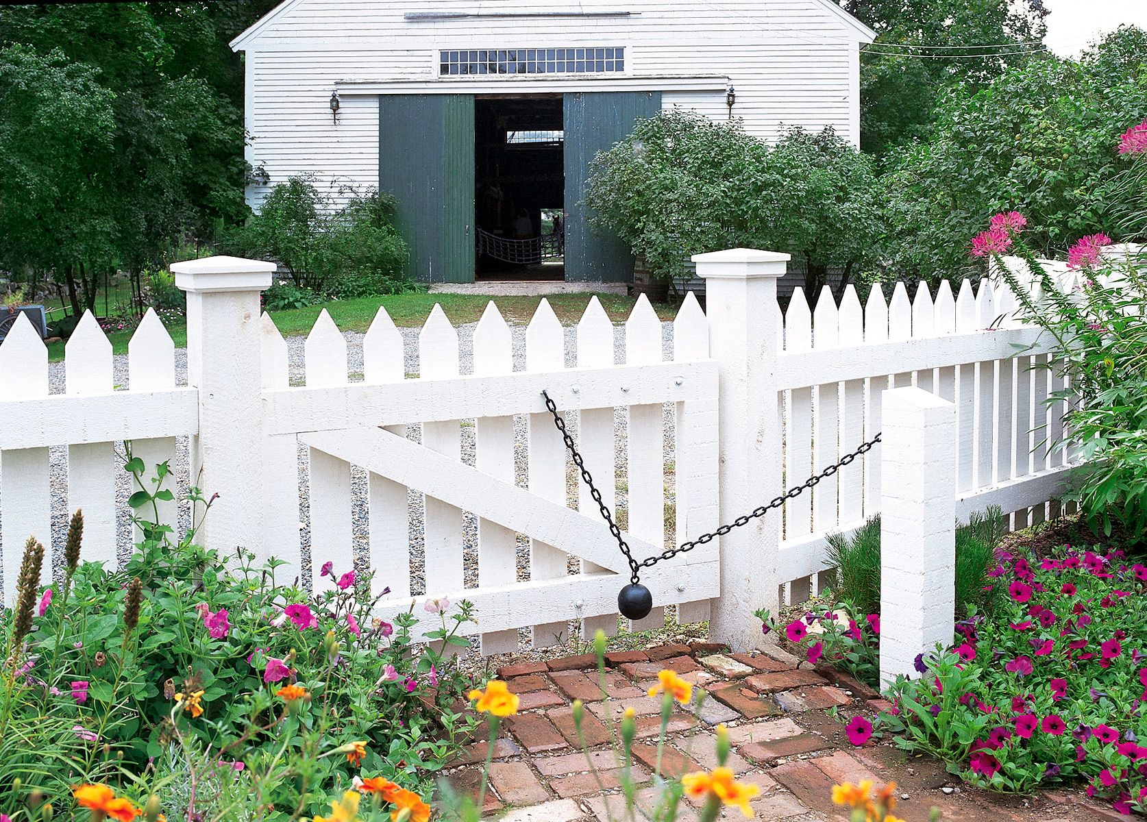 A picket fence held closed by a closure with a weighted ball.