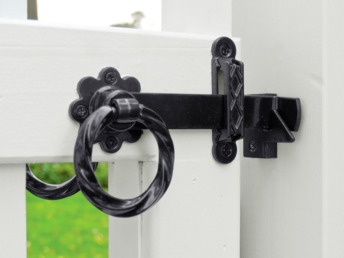 A picket fence with a latch holding it closed.