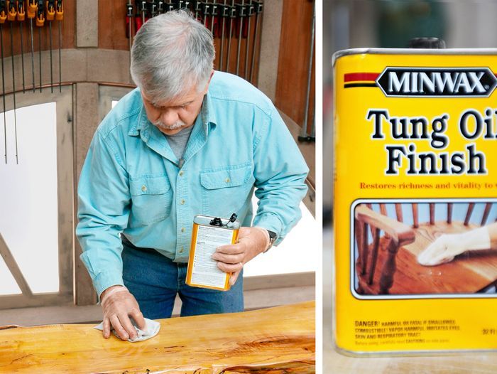 A man applying tung oil to a wooden table.