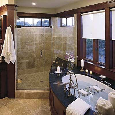 A shower with towel and robe hooks near by to help both able-bodied people and those with mobility issues.